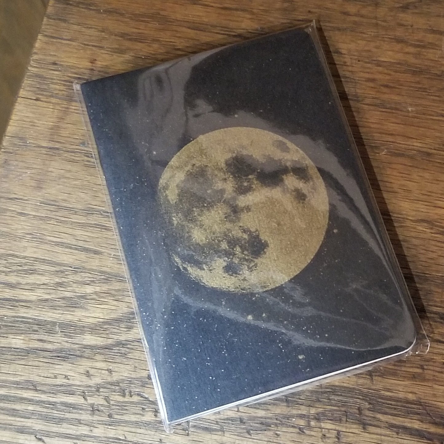 Juego de cuadernos con diseño de luna llena dorada