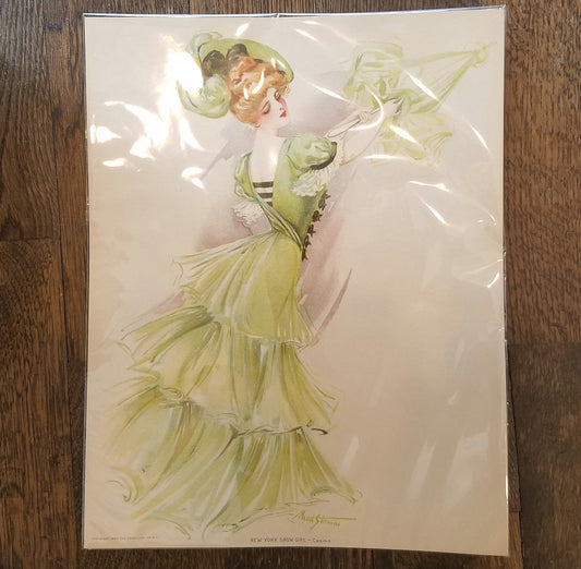 Victorian illustration of a red haired woman with hair in a top bun and a mint green hat. She is wearing a long, mint green gown with layers and puff sleeves and her back is to the front of the pose, with her hip raised slightly. She is gazing down towards her bottom.